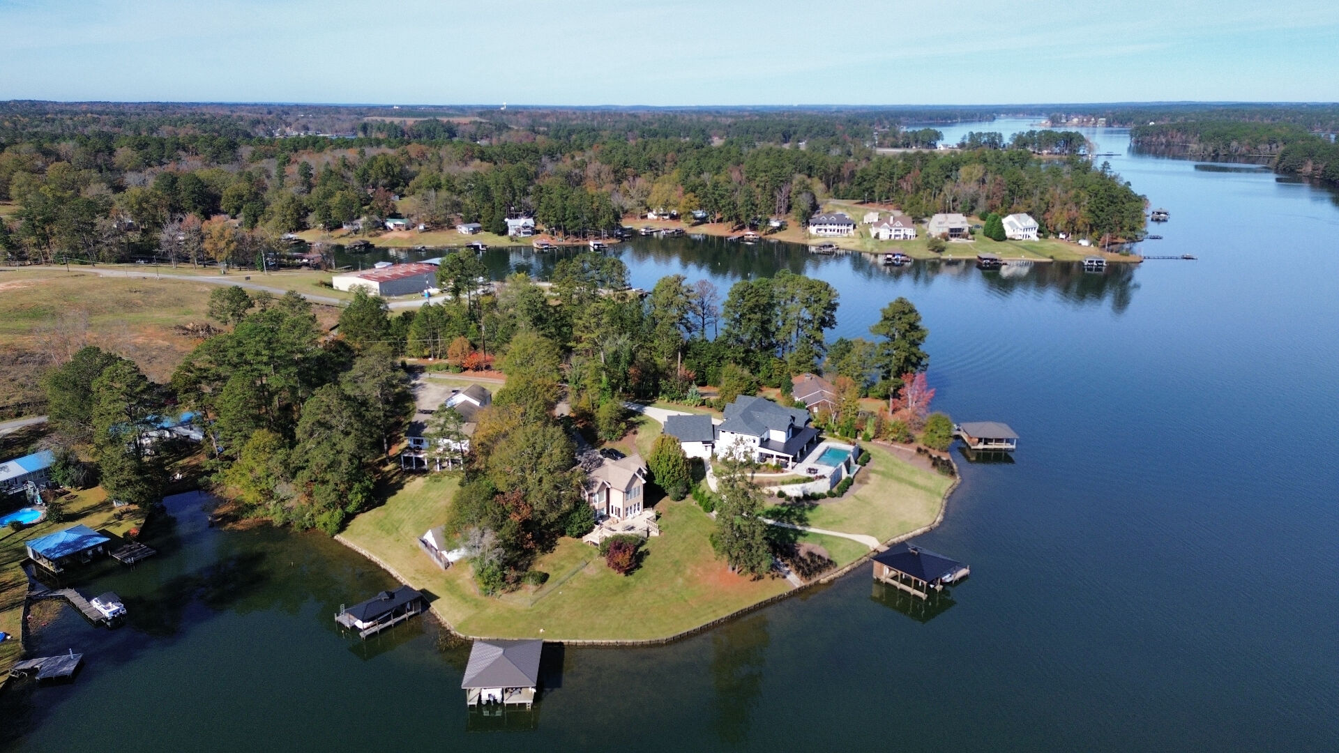 A wider look at the cove, the homes, and the open water beyond.
